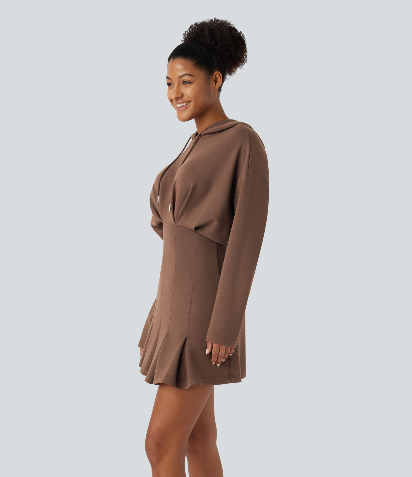 Mini dress with adjustable drawstring, off-the-shoulder design, long sleeves, pleated hem, hip wrap, and hood