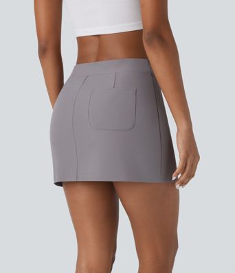 Mini-jupe décontractée en twill déperlante à taille basse avec ceinture en V, fermeture invisible et poche au dos