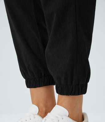 Pantalons de cyclisme en velours côtelé, taille mi-haute, coupe décontractée, avec poches zippées.