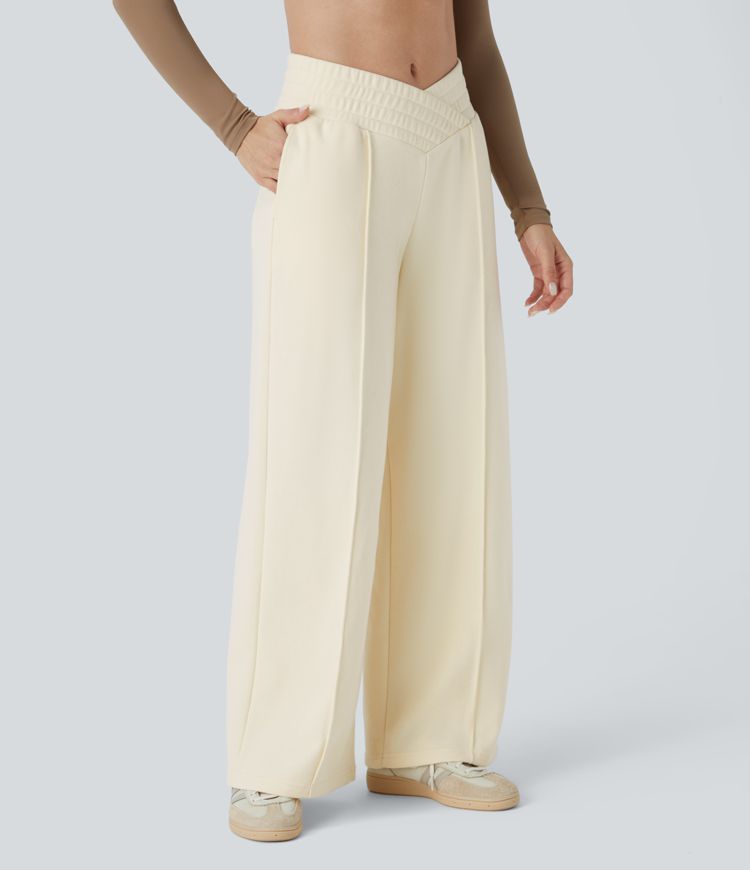 Crossover leisure pants with high waist, side pockets, and wide leg