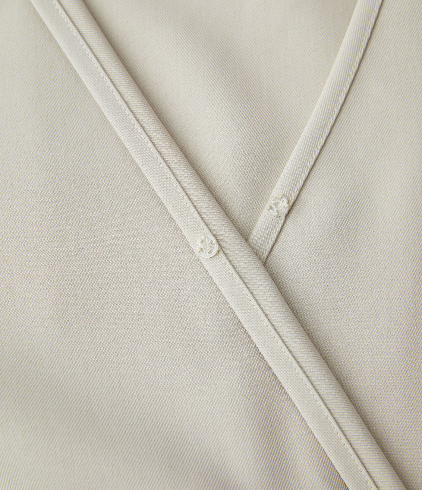 Mono pierna ancha bolsillo lateral cruzado manga larga cuello V botón