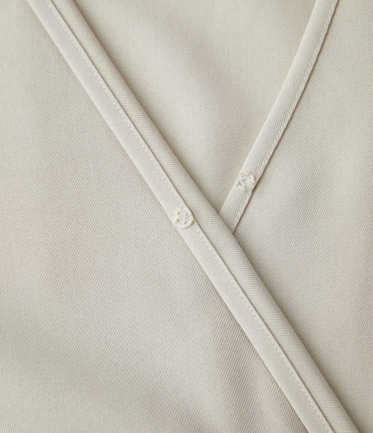 Mono pierna ancha bolsillo lateral cruzado manga larga cuello V botón