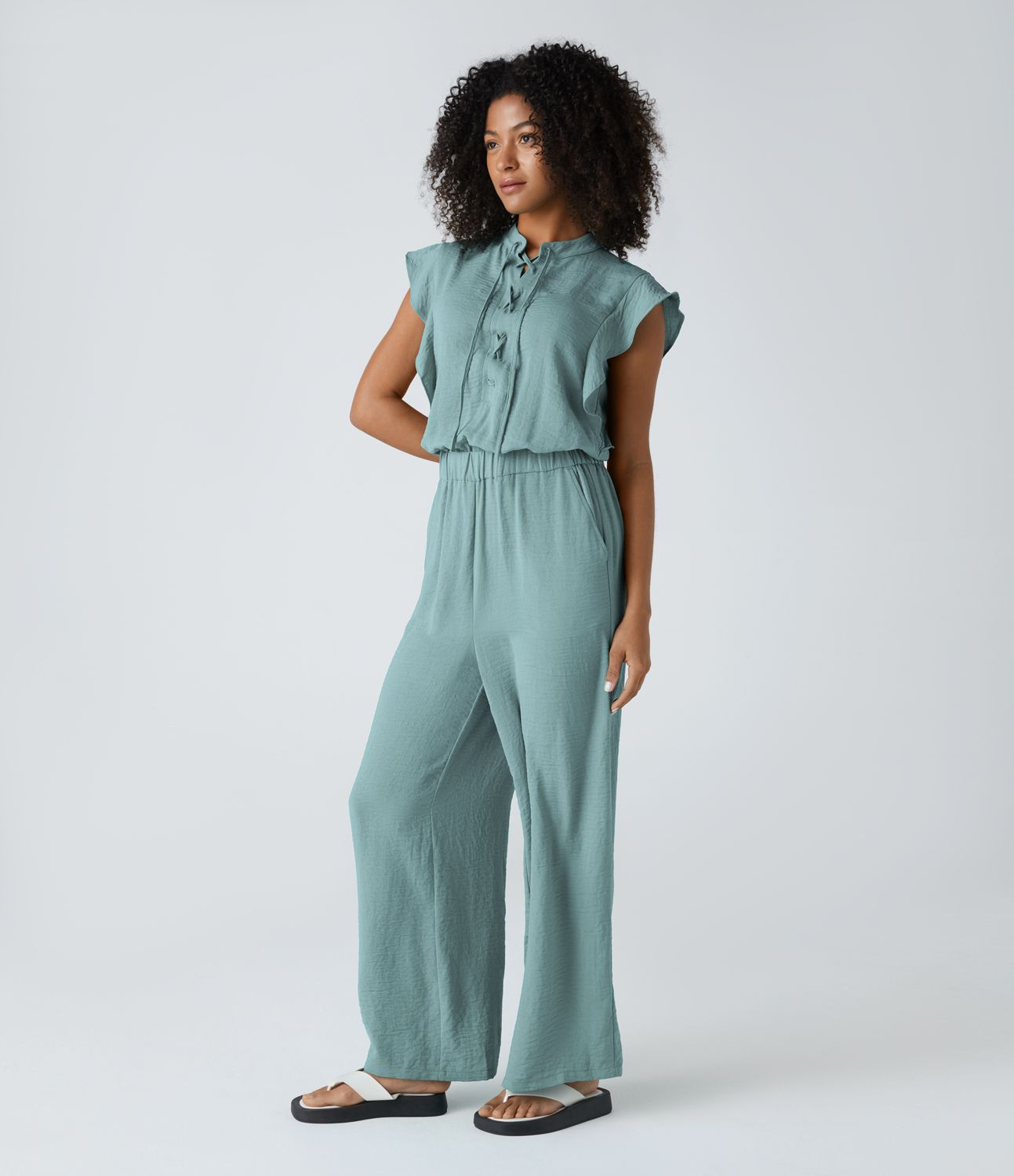 Cross strap ruffle cap sleeve button cutout side pocket casual linen feel jumpsuit