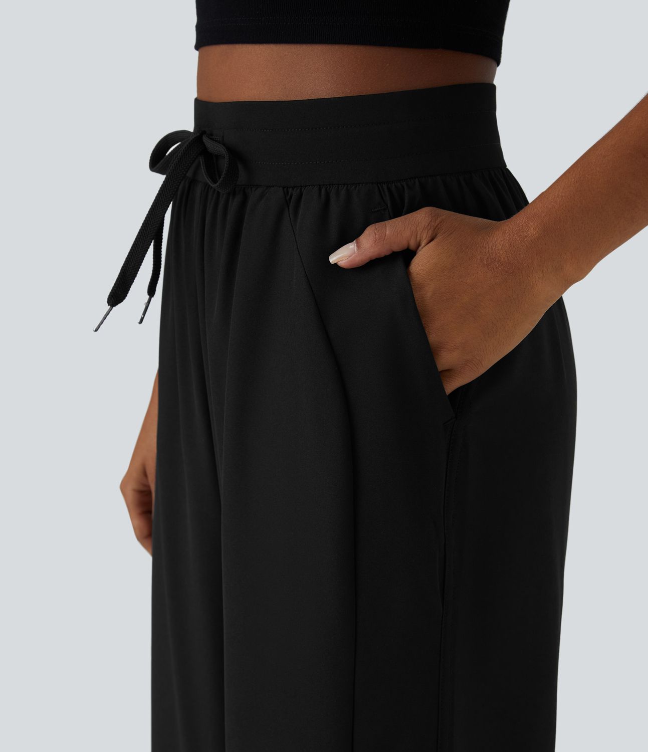 Pantalón pierna ancha bolsillo lateral cordón tiro alto