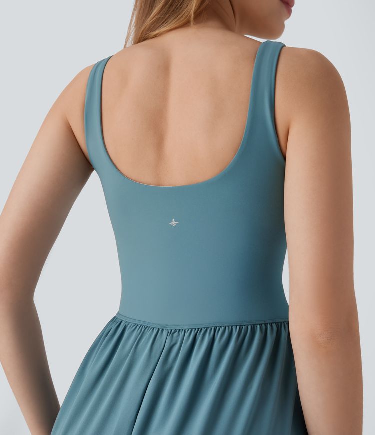 Mono Breezeful™ yoga secado rápido pierna recta bolsillo lateral sin espalda