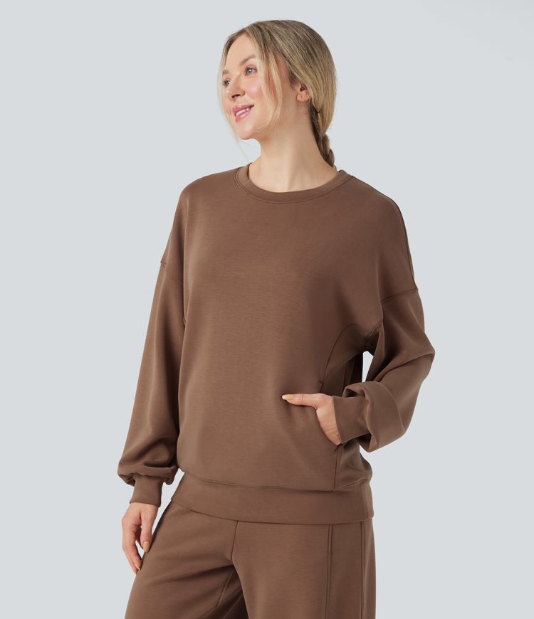 Sudadera casual de manga larga con escote redondeado y espalda cruzada con bolsillos