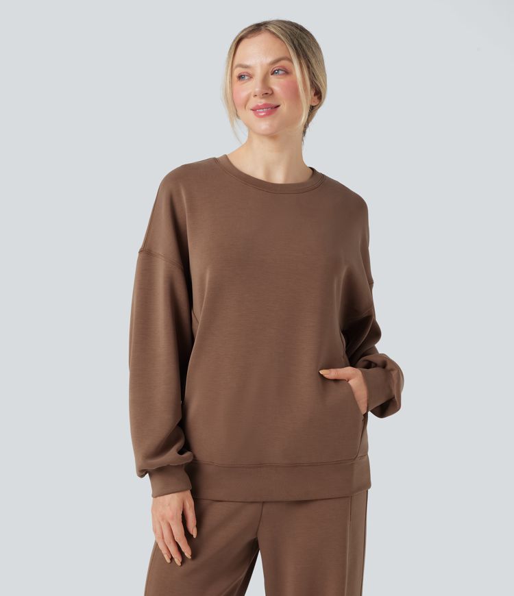 Sudadera casual de manga larga con escote redondeado y espalda cruzada con bolsillos