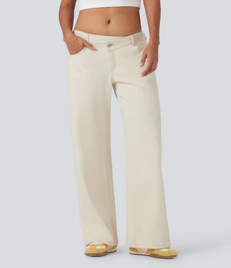Halara Flex™ Jean large asymétrique taille basse avec bouton, fermeture éclair et poches multiples, délavé et extensible en maille