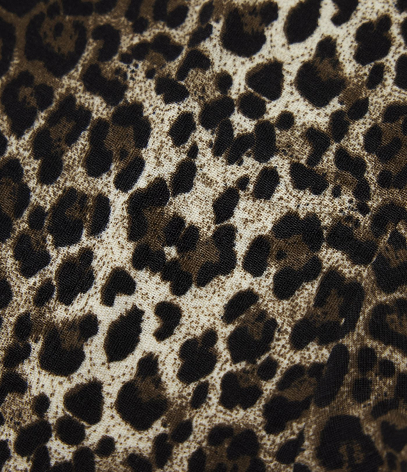 Top casual ceñido de manga larga con cuello redondo, estampado de leopardo y lazo en la espalda