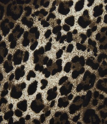 Top casual ceñido de manga larga con cuello redondo, estampado de leopardo y lazo en la espalda