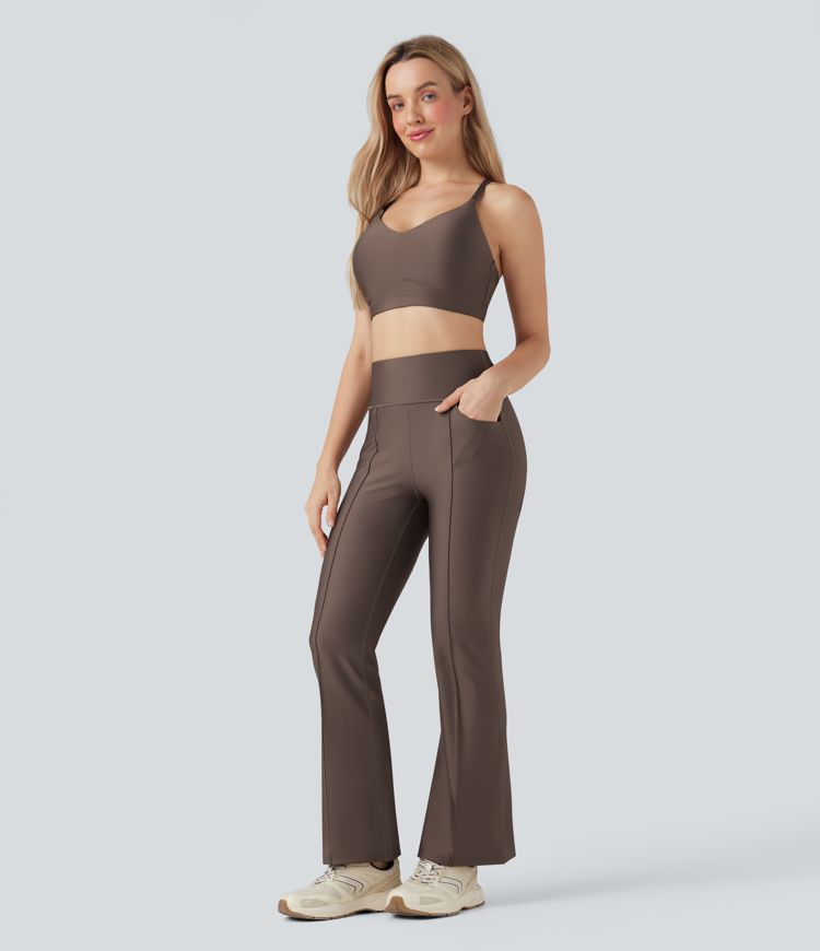 Bootcut training leggings with a high waist, side pockets and reflective trim.