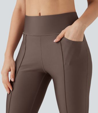 Bootcut training leggings with a high waist, side pockets and reflective trim.