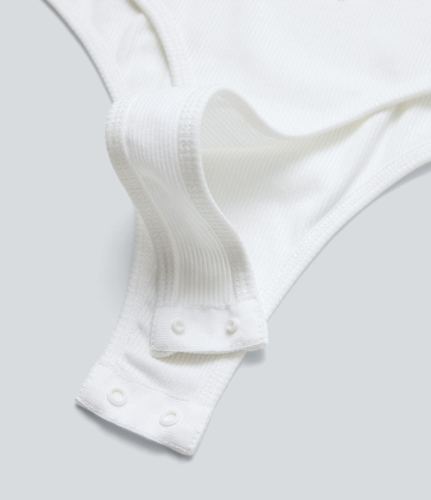 Arbeitsbodysuit aus geripptem Strick mit U-Ausschnitt und langen Ärmeln