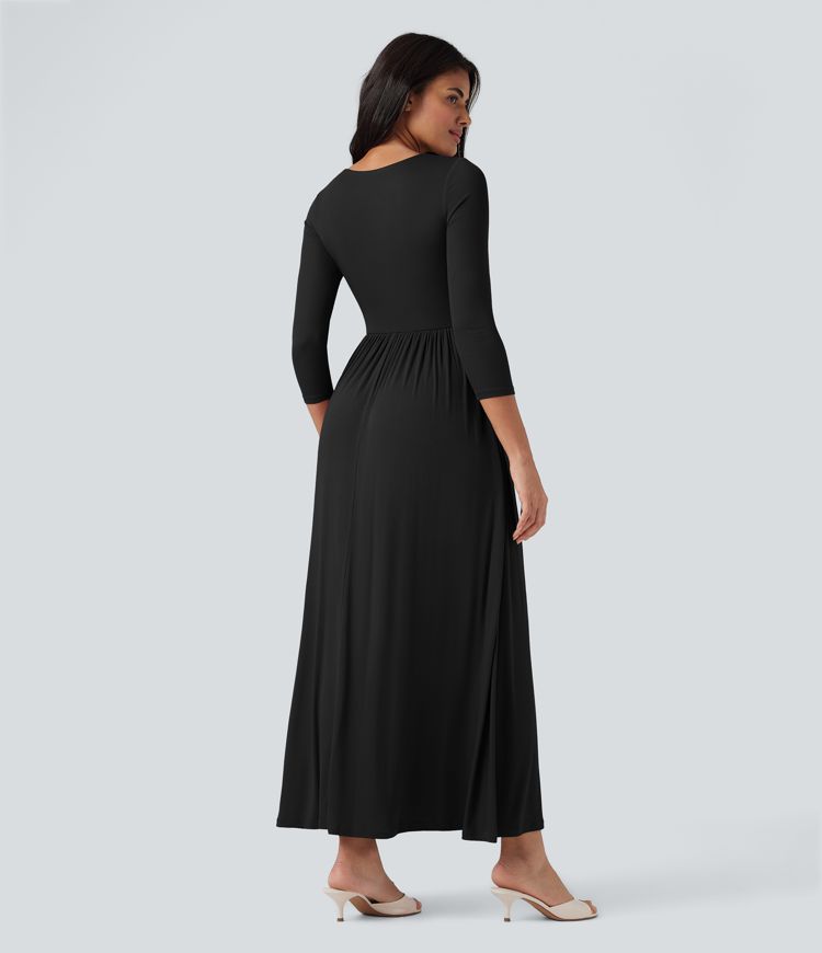 Long, flowy, casual ribbed knit dress with a round neck and three-quarter sleeves, featuring pockets.