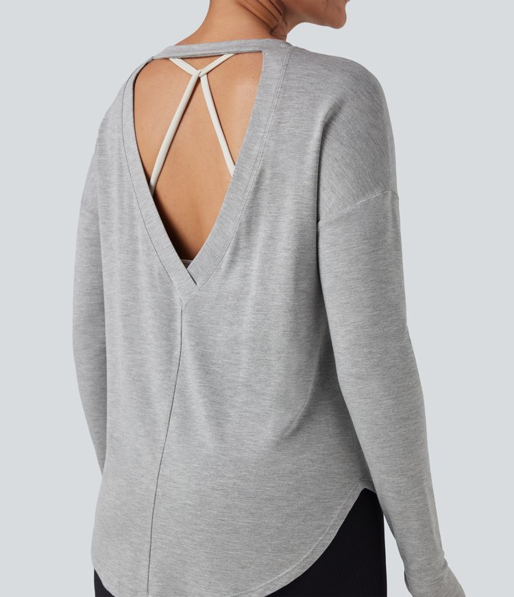 Sudadera casual holgada de manga larga con aberturas en la espalda y dobladillo curvo