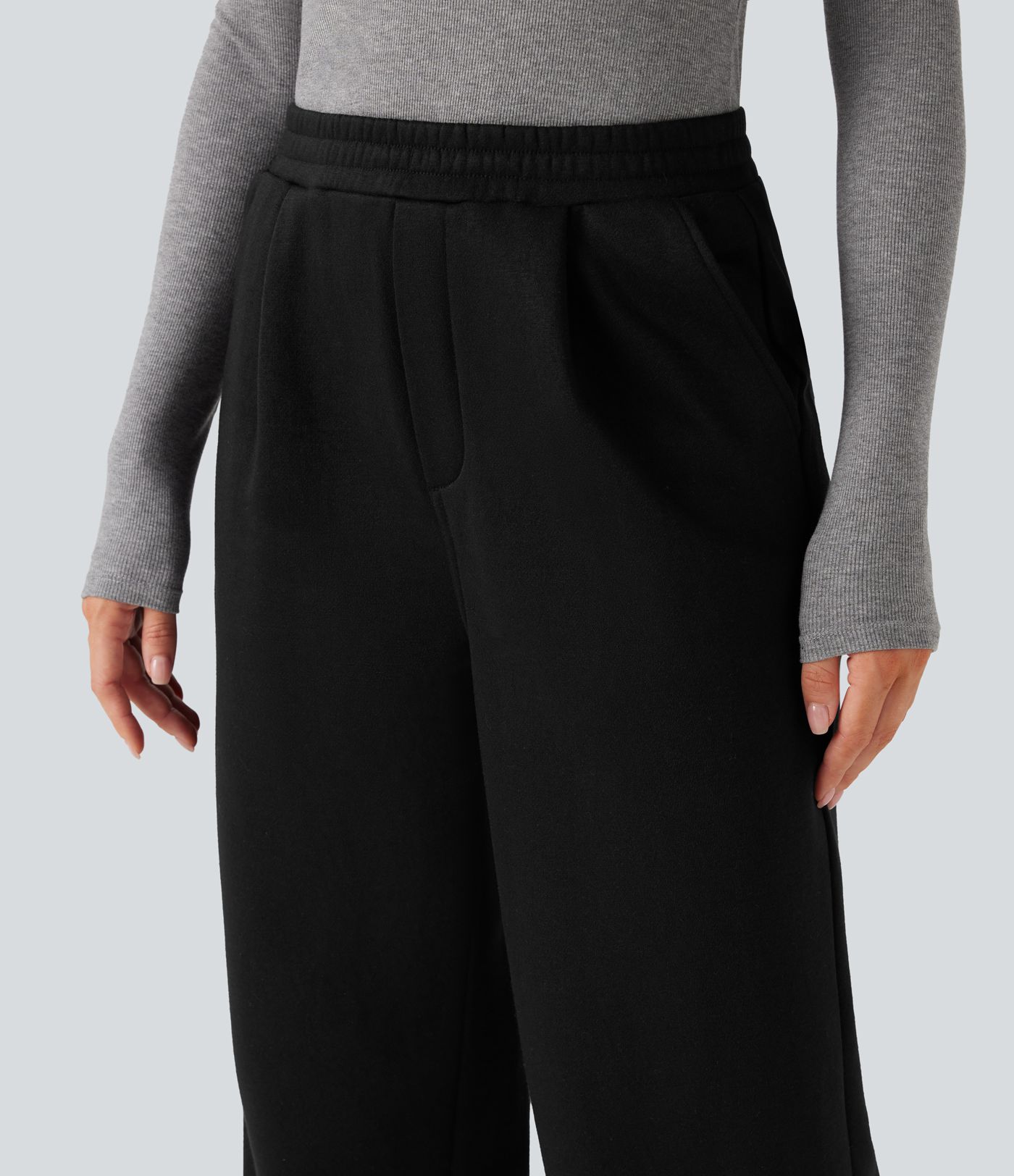 Fleece work trousers with high waist, straight legs, and pockets