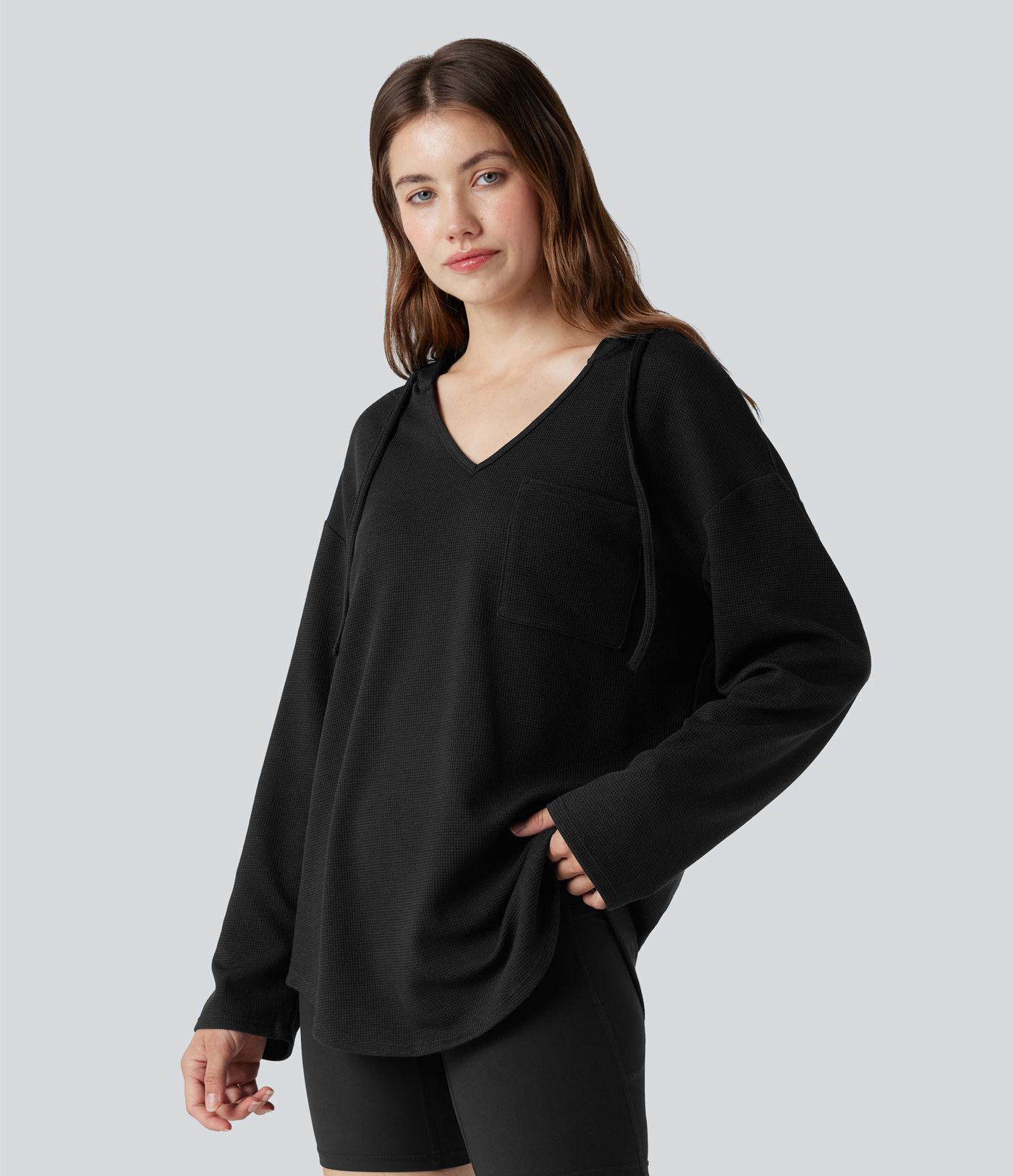 Sweat-shirt à capuche gaufré cordon de serrage manches longues ourlet arrondi avec poche