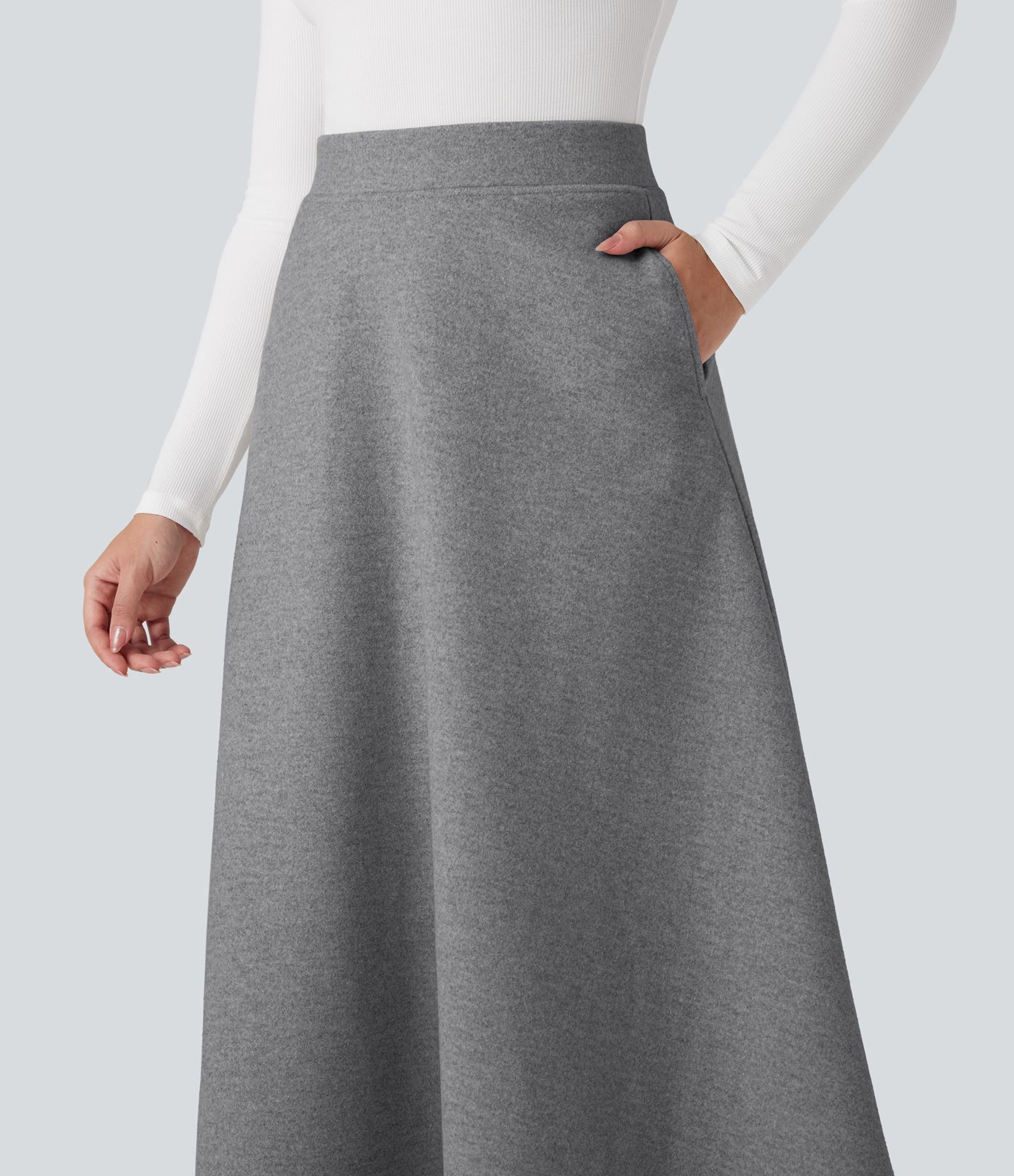 Jupe mi-longue évasée polaire taille haute avec poches