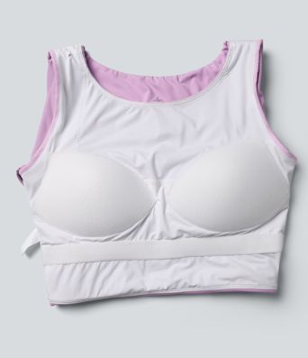 Trumpintas jogos sportinis topas su push-up efektu, formuotais spacer kaušeliais, apvalia iškirpte, ilgomis rankovėmis su nykščių angomis ir kryžminiu dizainu.