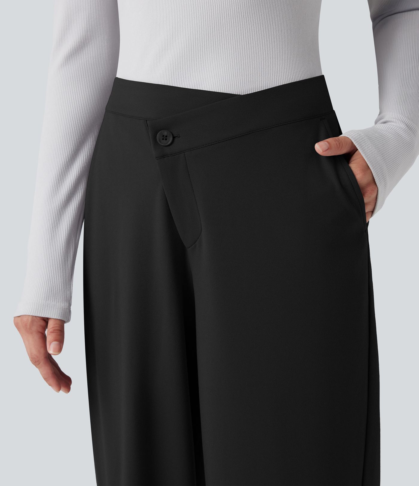 Pantalones casuales asimétricos de tiro medio y pernera ancha con bolsillos