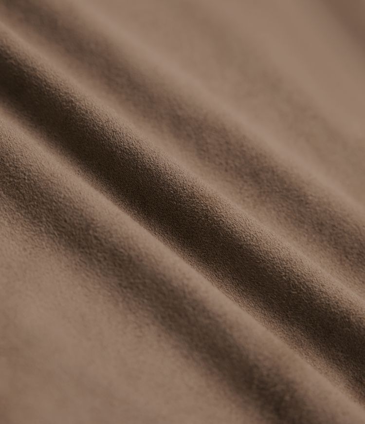 Jupe mi-longue évasée daim taille haute avec poches