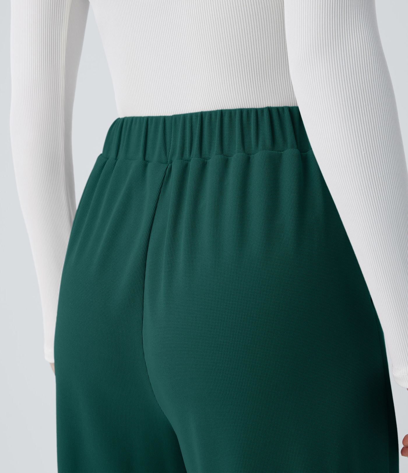 Pantalón tiro alto botón bolsillo lateral plisado pierna ancha