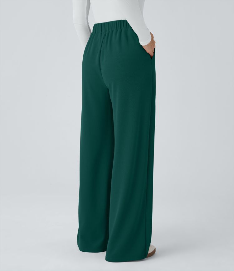 Pantalón tiro alto botón bolsillo lateral plisado pierna ancha