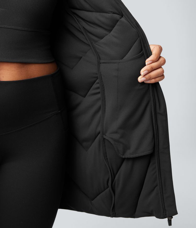 Veste matelassée col montant double fermeture éclair avec trous pouces et poches