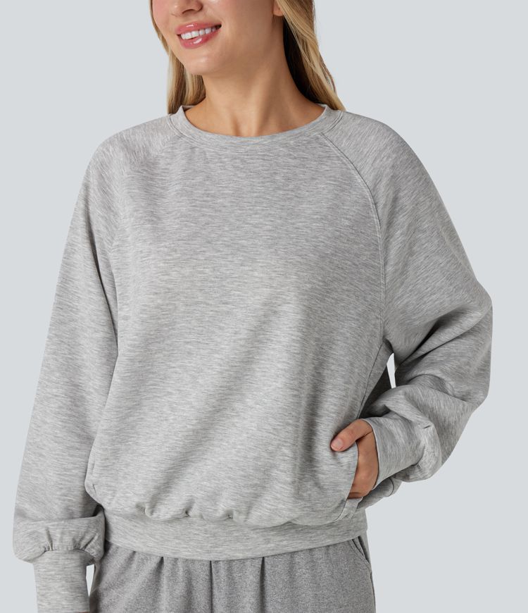 Sweat-shirt col rond manches longues à découpes avec poches