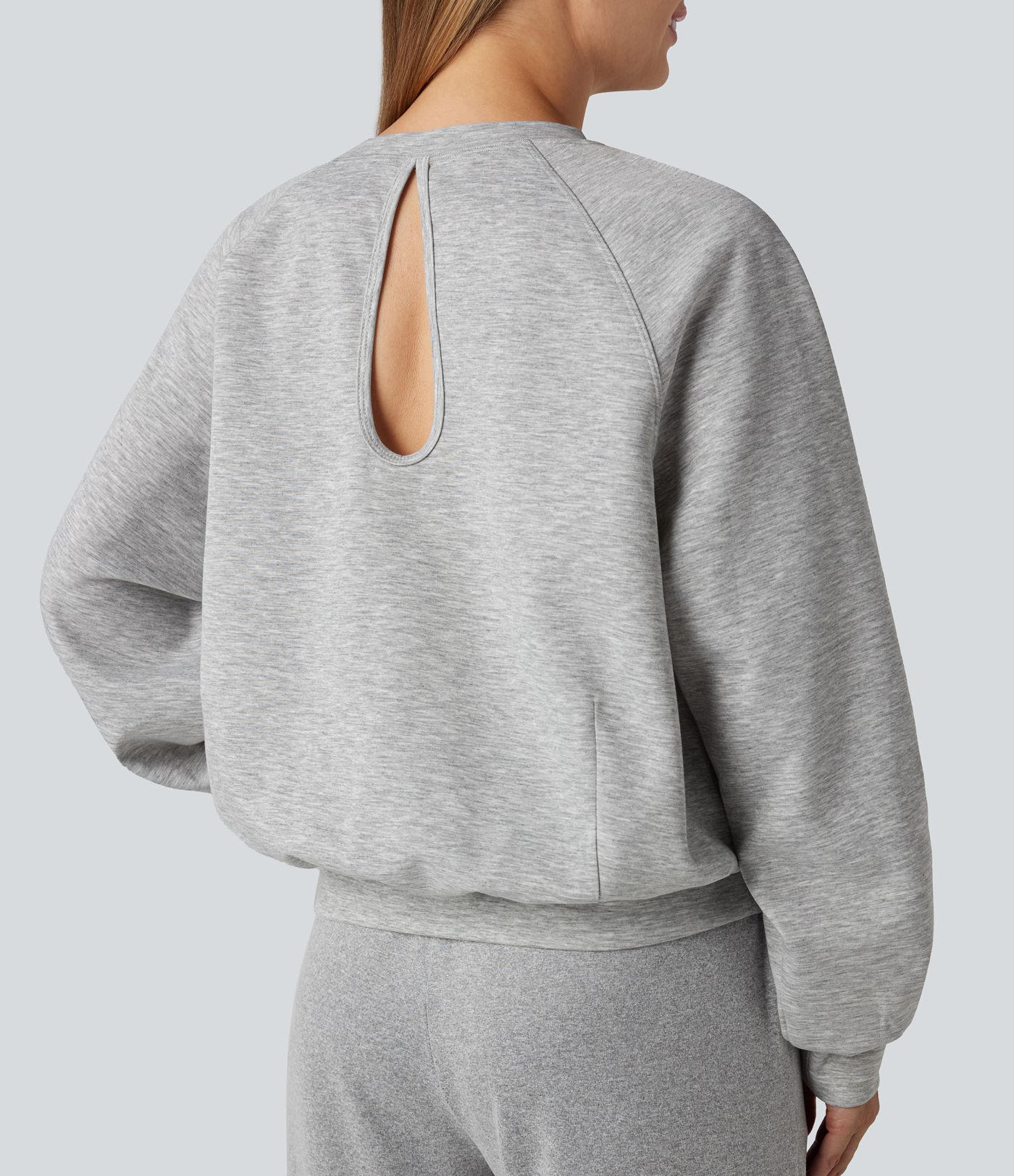 Sweat-shirt col rond manches longues à découpes avec poches