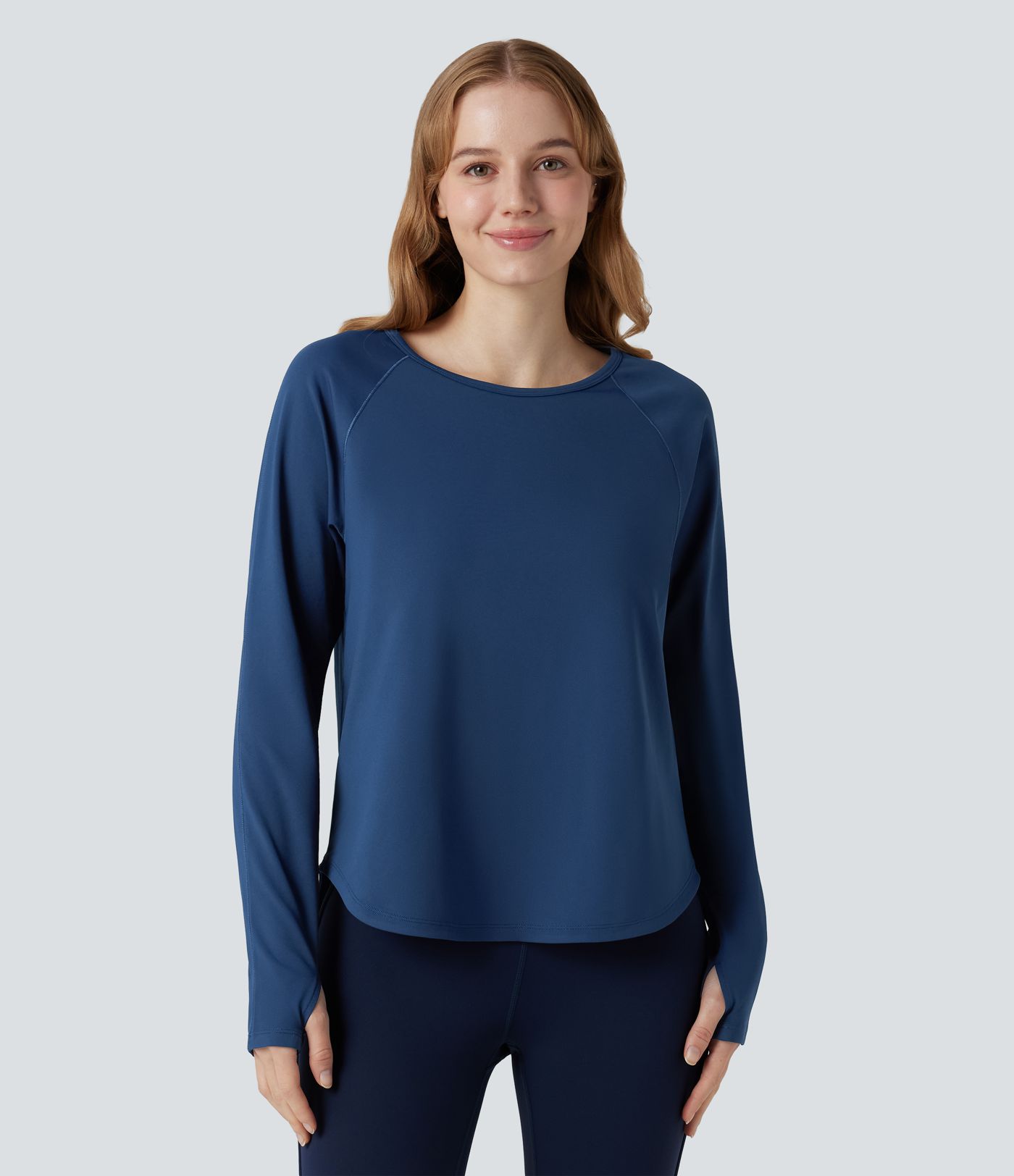 Top de sport à encolure ronde, manches longues, ouverture pour le pouce et empiècements en maille contrastée