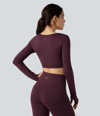 Top corto deportivo para yoga sin costuras, de manga larga, con cut-out fluido y agujero para el pulgar.