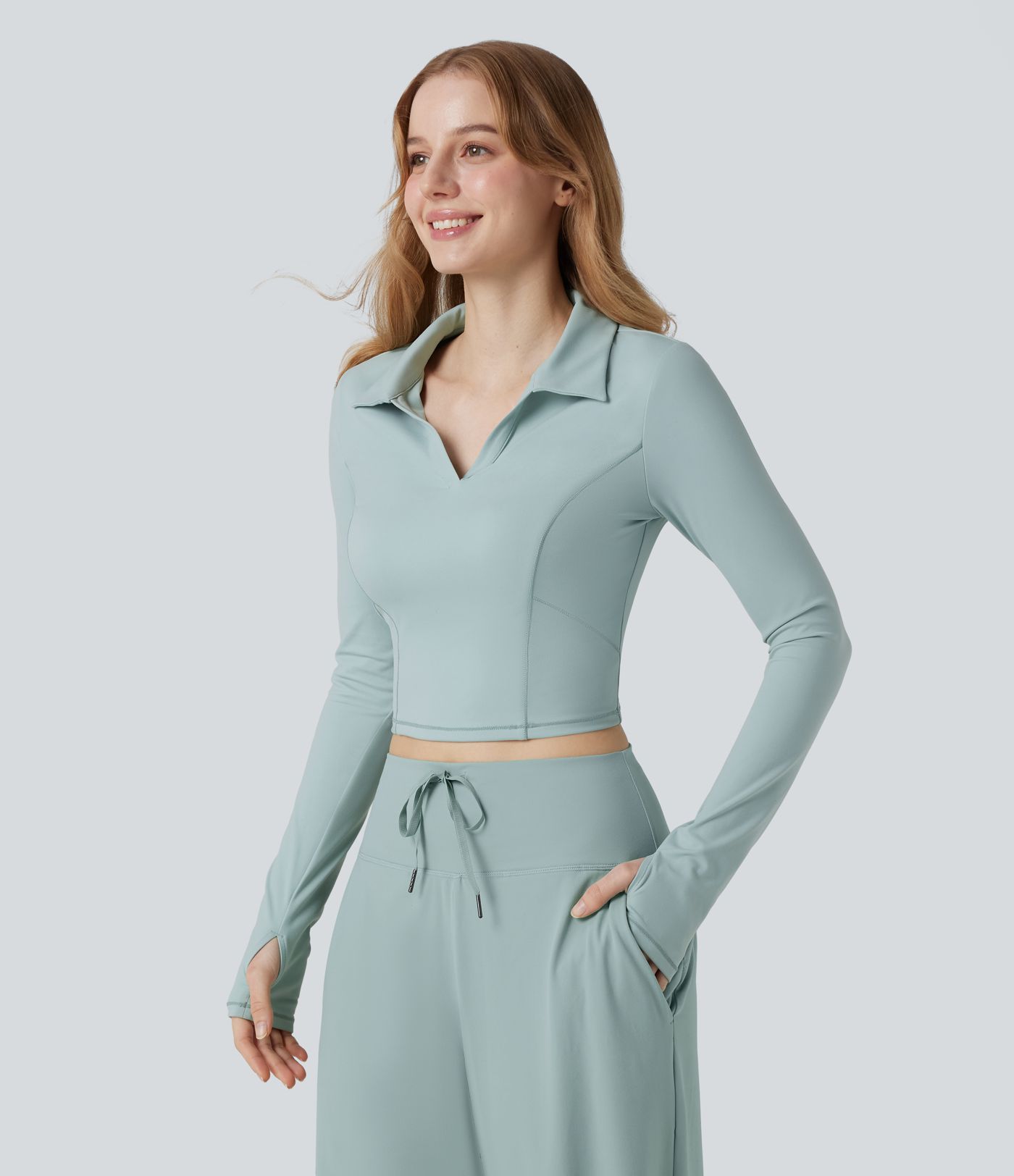 SoftlyZero™ polo in morbido tessuto plush, maniche lunghe, foro per il pollice, top corto sportivo da tennis