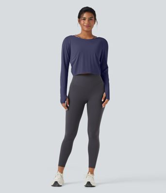 SoftlyZero™ nopeasti kuivuva 2-in-1 jooga- ja treenitoppi, avonaisella takamallilla (twist), pitkät hihat ja peukaloreiät