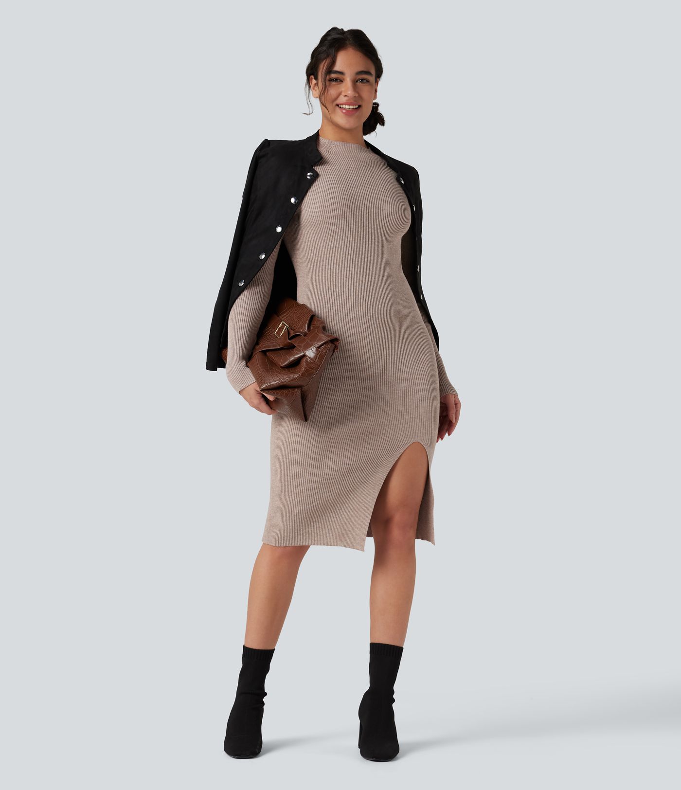 Form-fitting mid-length sweater dress with high neckline, long sleeves, and a slit