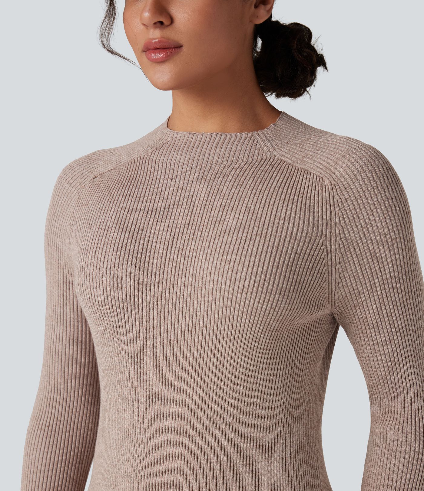 Form-fitting mid-length sweater dress with high neckline, long sleeves, and a slit