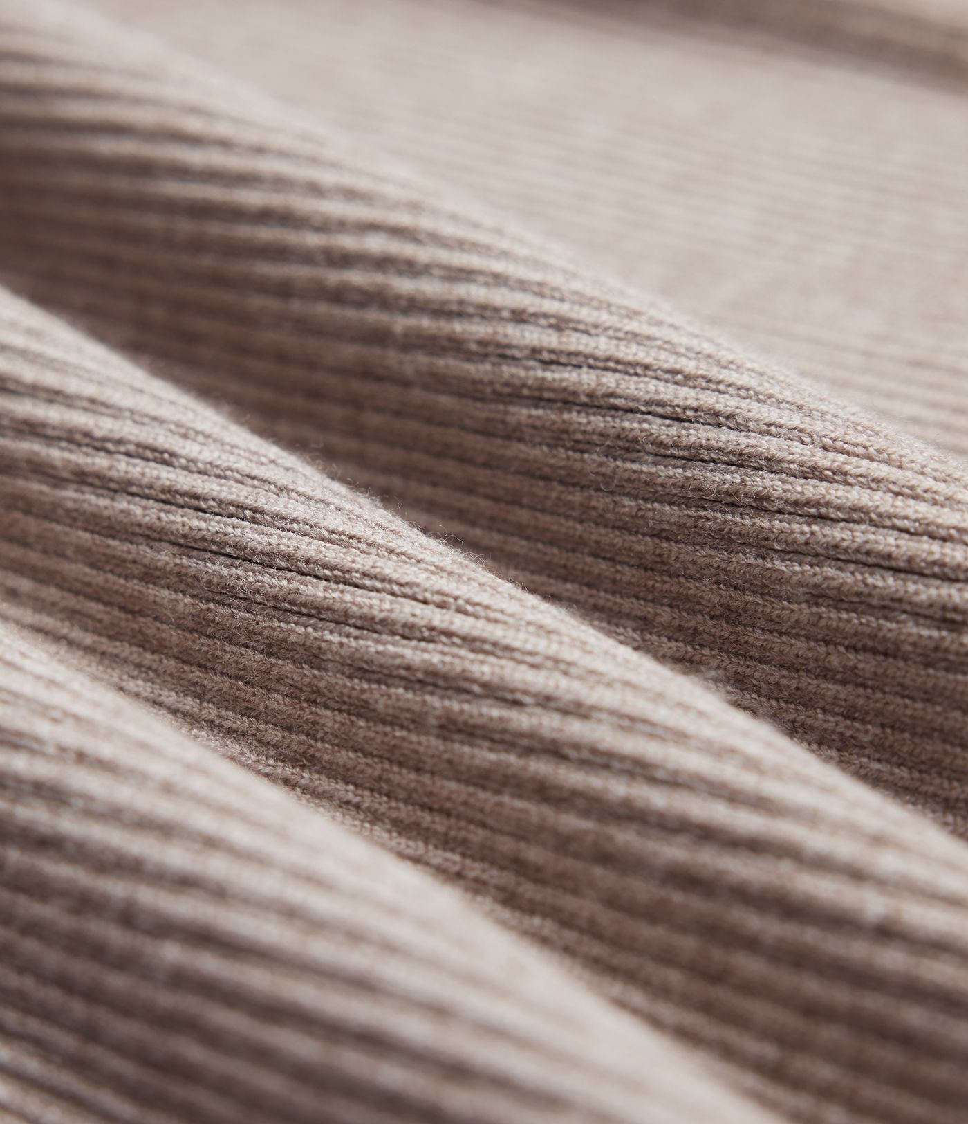 Form-fitting mid-length sweater dress with high neckline, long sleeves, and a slit