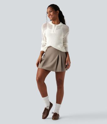 Pull décontracté à col rond avec demi-zip, manches longues et découpes.