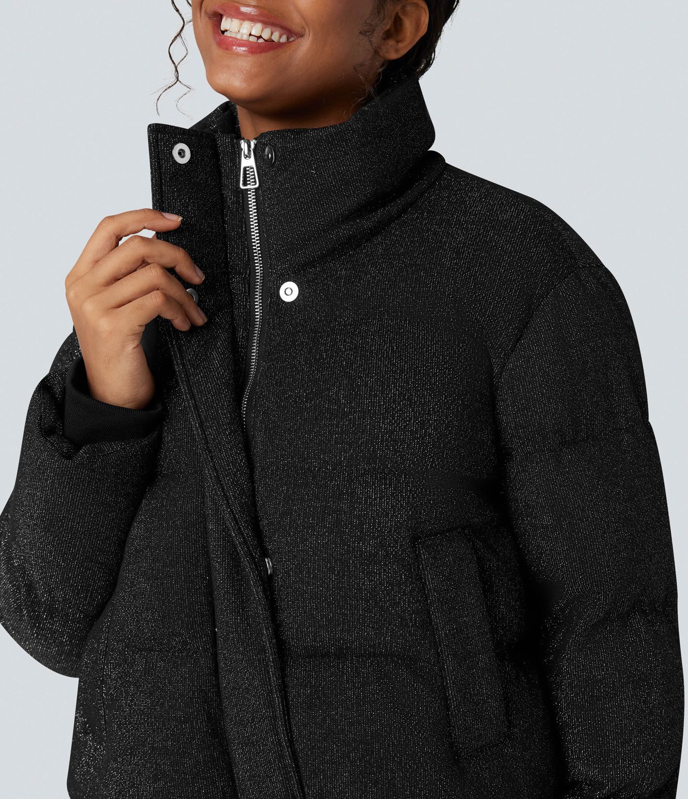 Puffer jacket with a high collar, sparkle effect, and pockets