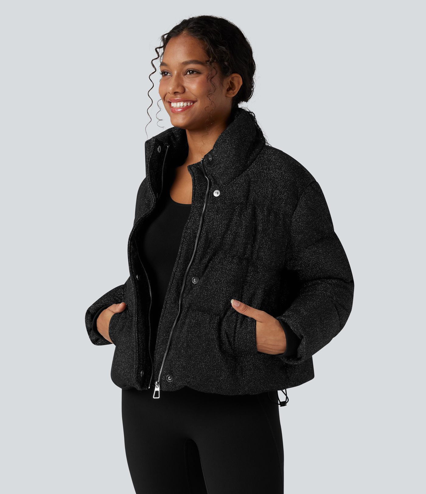 Puffer jacket with a high collar, sparkle effect, and pockets
