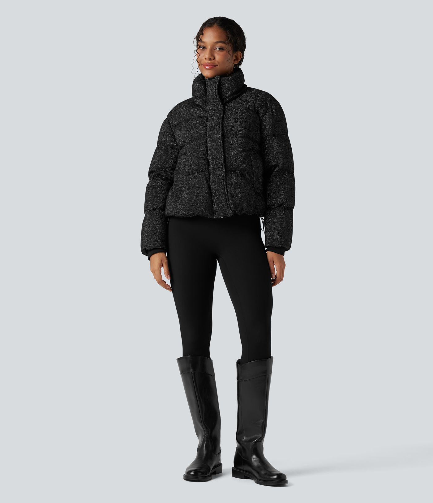 Puffer jacket with a high collar, sparkle effect, and pockets