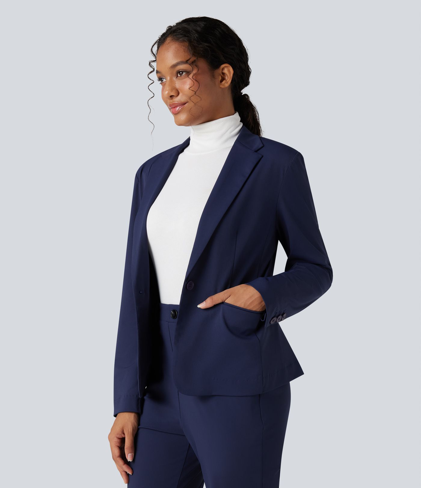 Kreukbestendige, slim-fit werkblazer met lange mouwen, revers met inkeping en zakken.