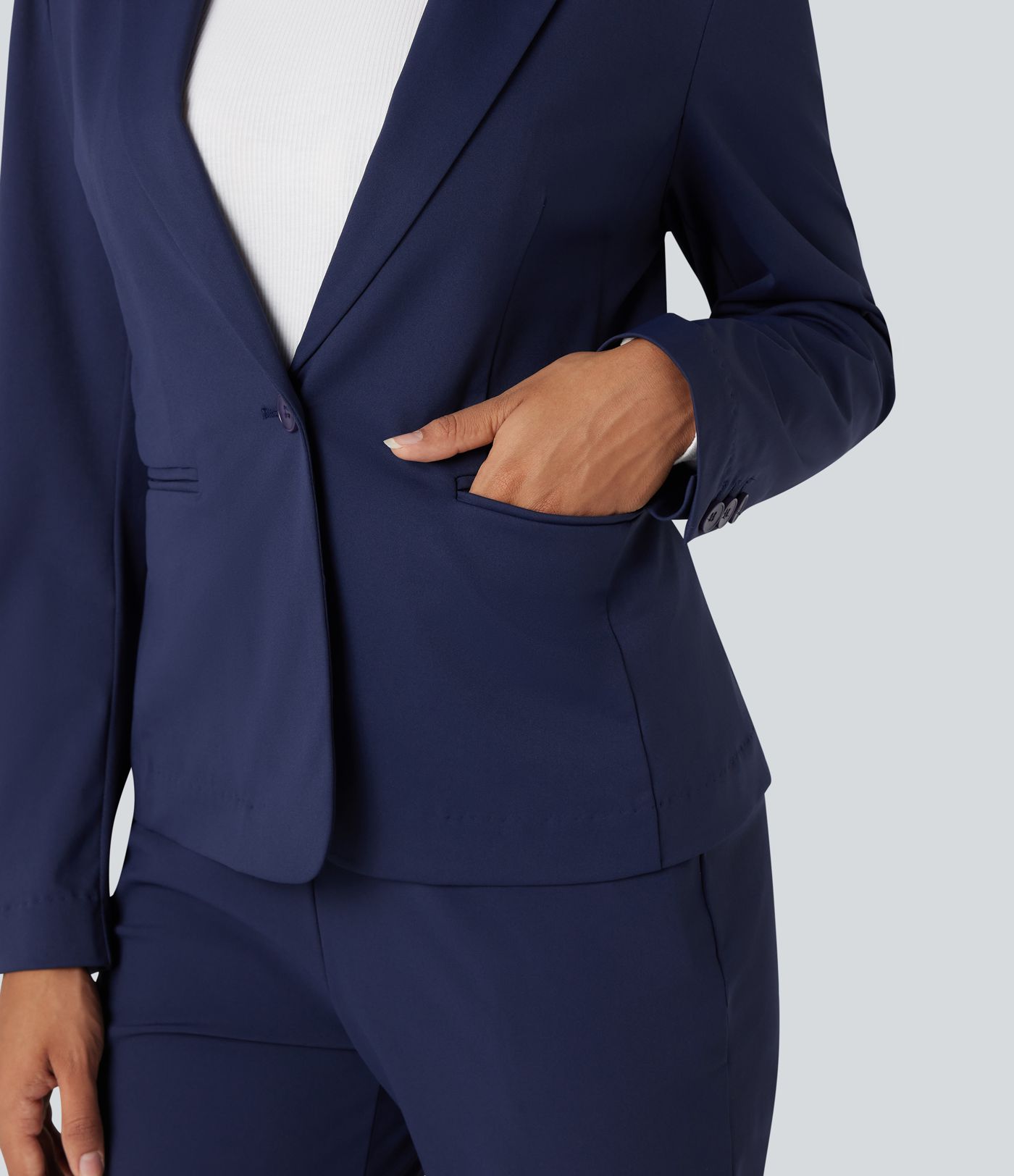 Kreukbestendige, slim-fit werkblazer met lange mouwen, revers met inkeping en zakken.