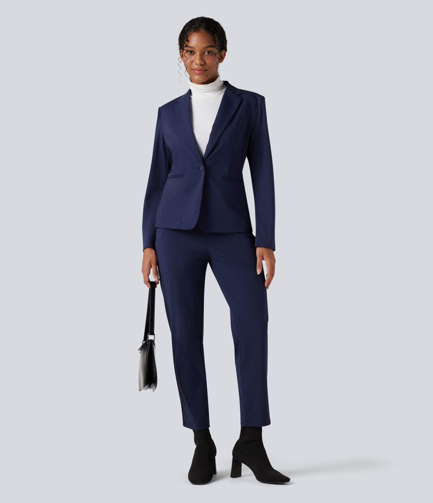 Kreukbestendige, slim-fit werkblazer met lange mouwen, revers met inkeping en zakken.