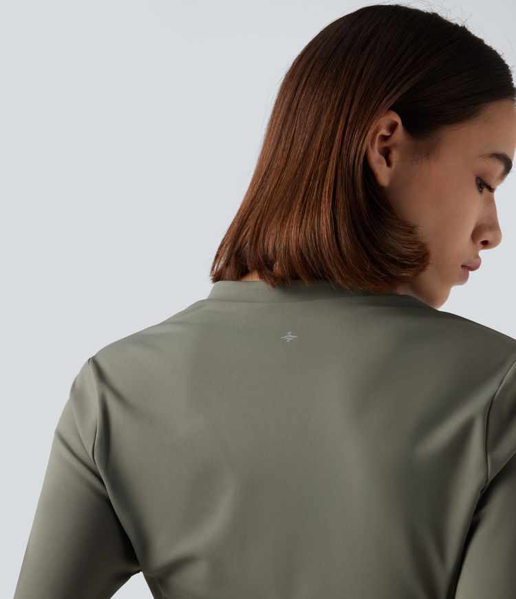 Fleece-yoga- og treningstopp med stående krage, halv glidelås, lange ermer og tommelhull