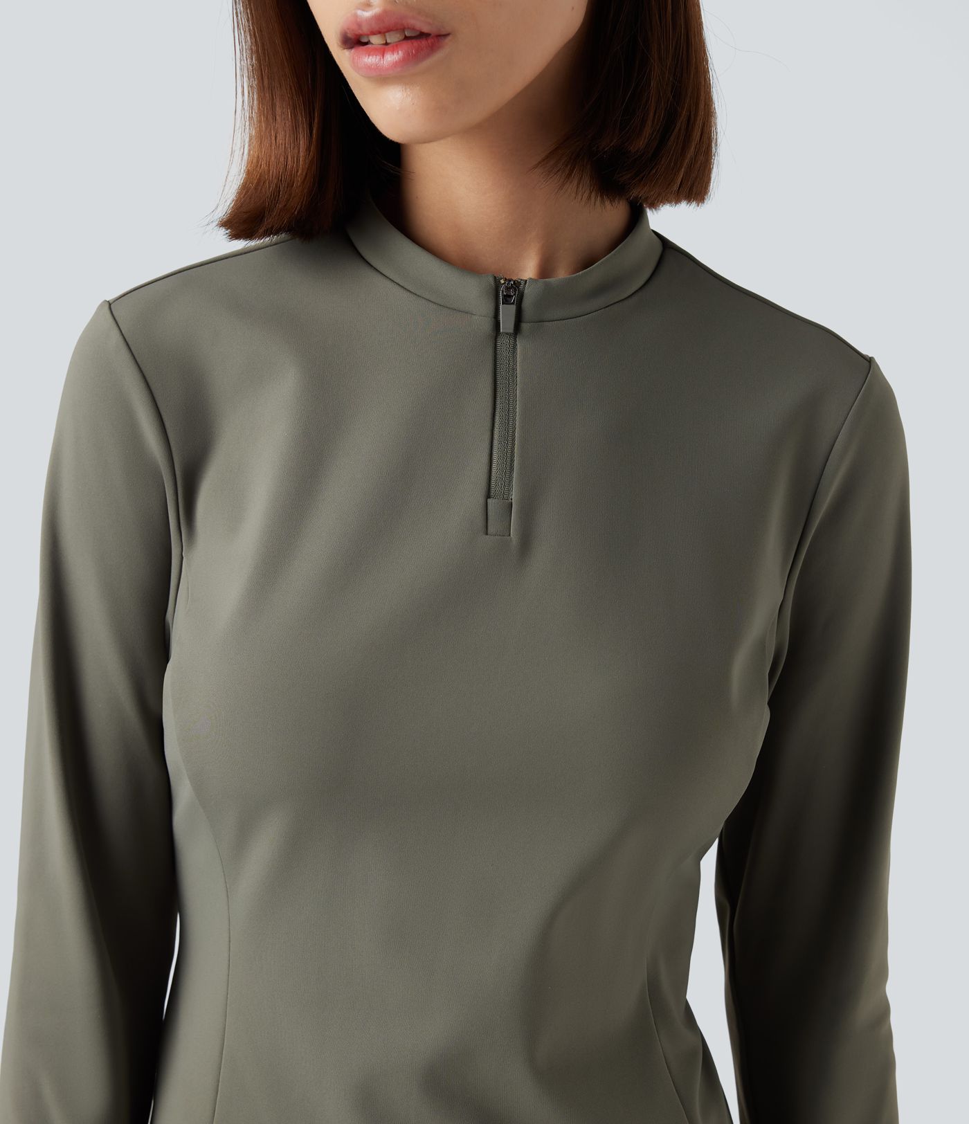 Fleece-yoga- og treningstopp med stående krage, halv glidelås, lange ermer og tommelhull