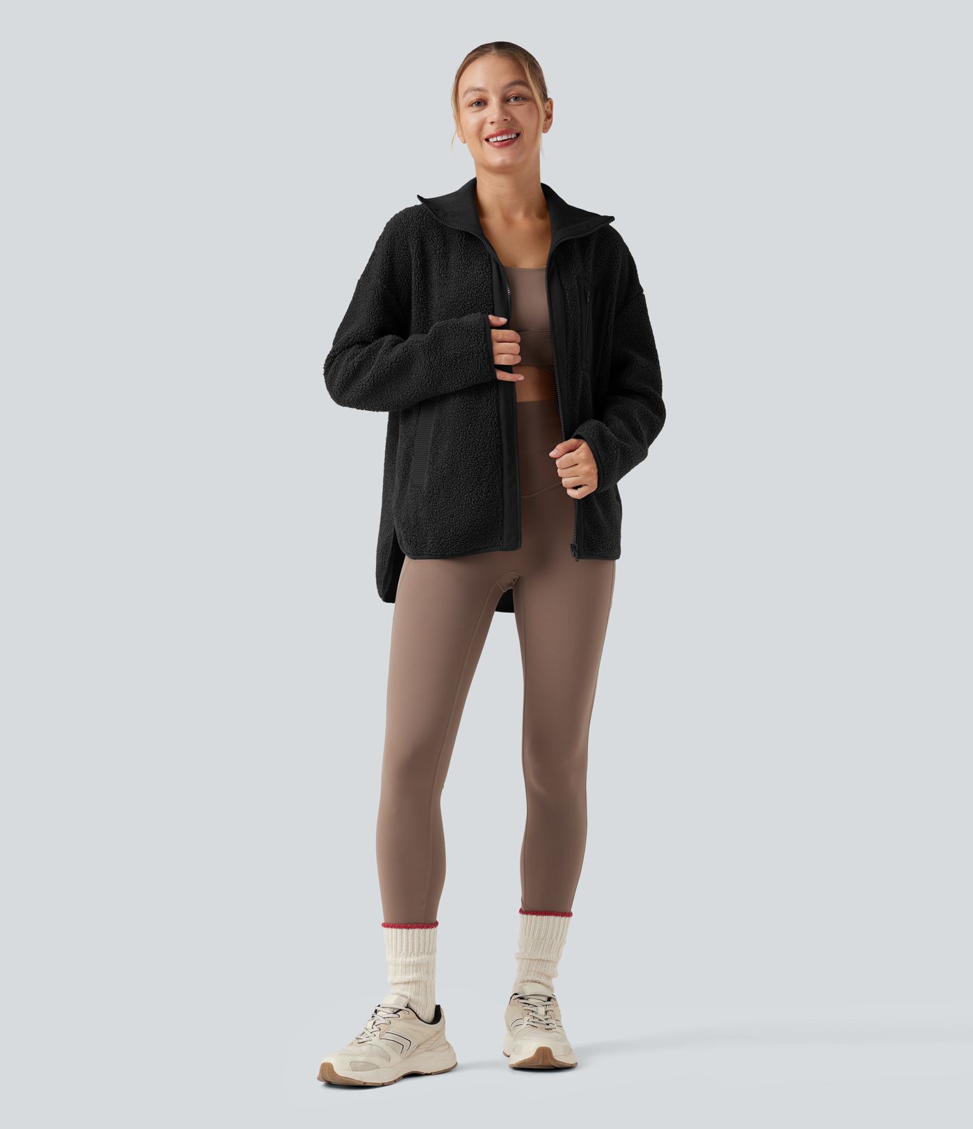 Veste de sport sherpa à manches longues avec ourlet asymétrique arrondi et poches