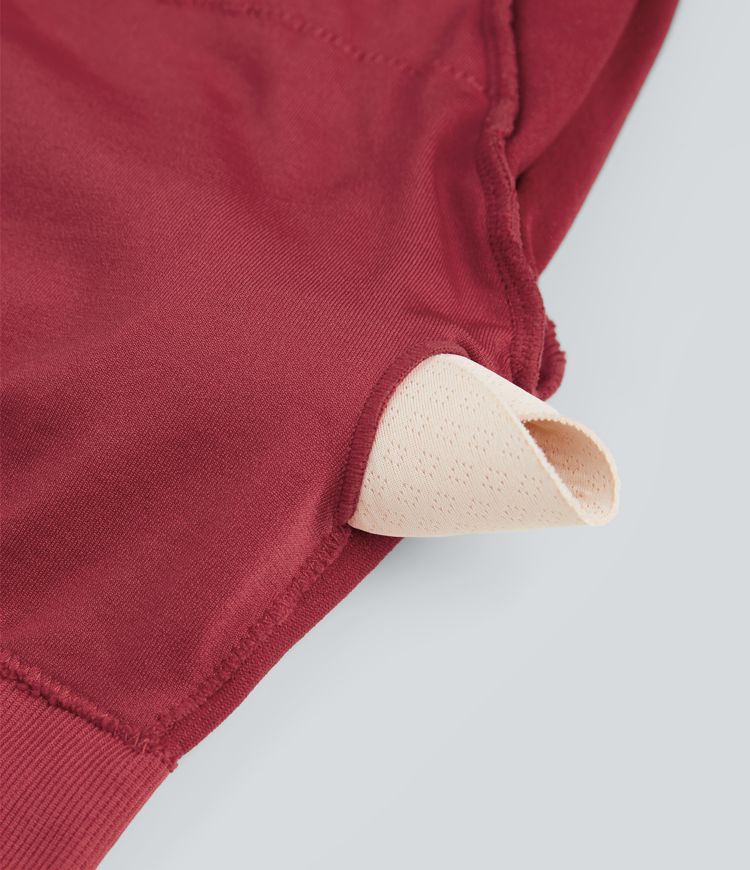 Metallic-Optik, nahtloses Flow-Sporttop mit Rundhalsausschnitt, langen Ärmeln und Daumenloch – kurz geschnitten