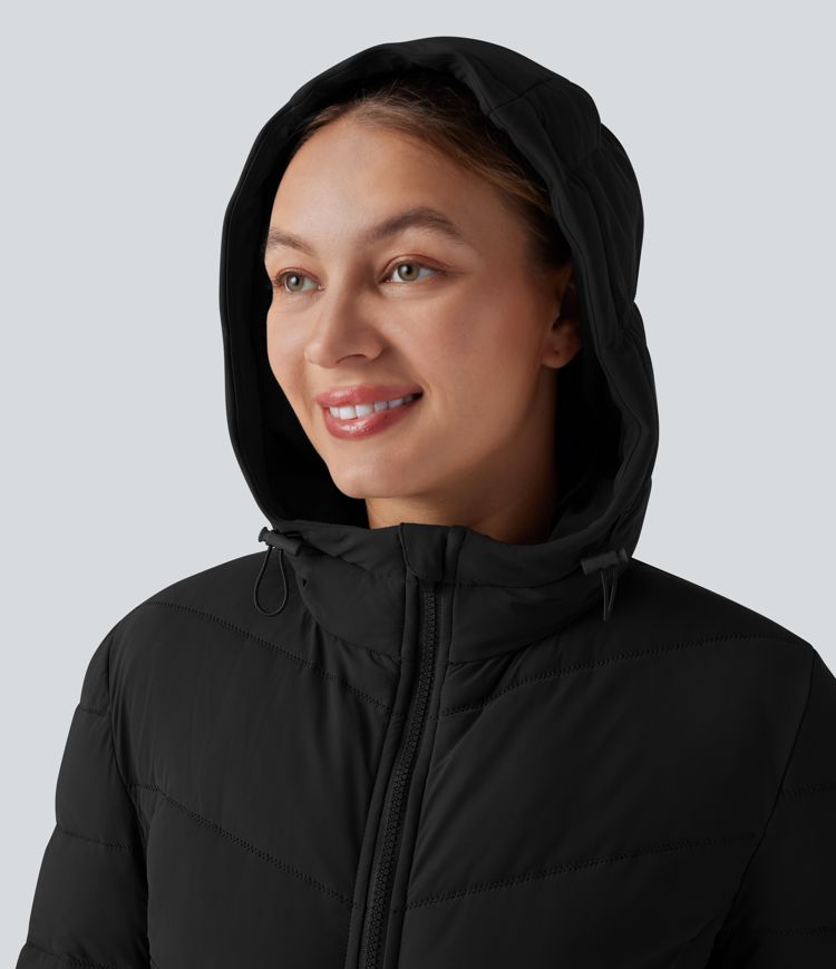 Huppullinen, pitkä, joustava ja rento toppatakki taskuilla