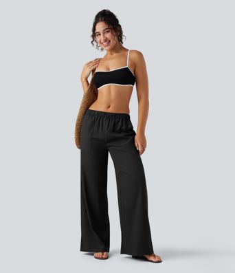 Pantalones holgados de cintura alta estilo resort con bolsillos